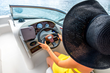 Woman driving yacht