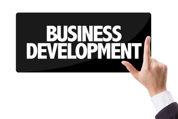 Businessman pressing button with the text: Business Development