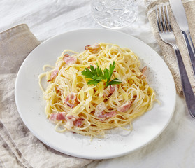 pasta carbonara on white plate
