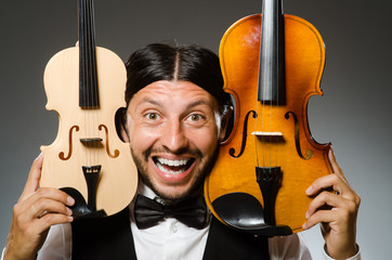 Man playing violin in musical concept