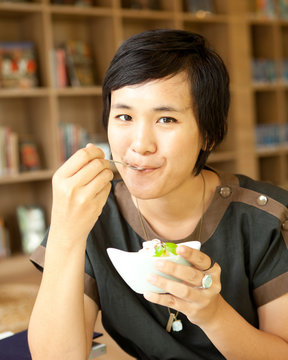 Asian Woman Eating Ice Cream