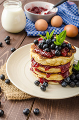 Glutten-free pancakes with jam and blueberries