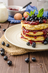 Glutten-free pancakes with jam and blueberries