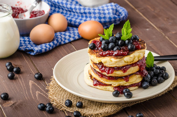 Glutten-free pancakes with jam and blueberries