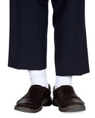 Closeup of man wearing white socks with brown loafers and dress