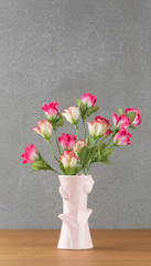 plastic rose in vase