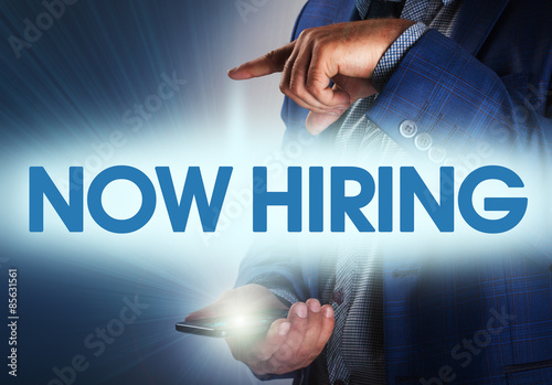 Businessman presses button how hiring on virtual screens Businessman presses button how hiring on virtual screens