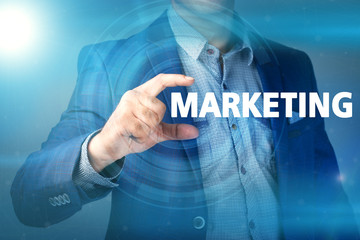 Businessman presses button marketing on virtual screens. Busines