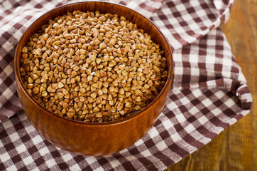 Buckwheat in  a wooden bowl.