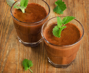 Homemade Chocolate Mousse in glasses on   wooden table.