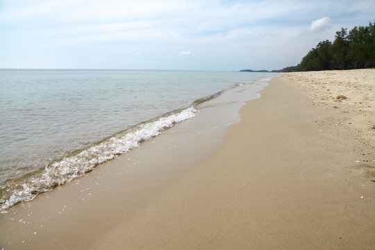 sand beach and waves of thai Sea.