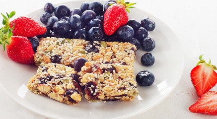 Granola bars with fresh berries for  healthy breakfast.