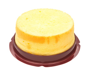 side view home made round sponge cake on white with clipping pat