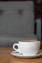 hot coffee on wood table