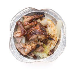 lunch box of roasted duck on white with clipping path