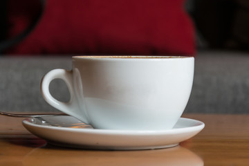 hot coffee on wood table