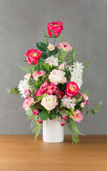 plastic rose in vase