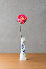 plastic rose in vase