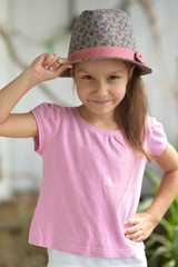 Little girl in hat posing