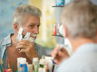 Senior man shaving