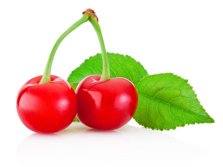Two ripe cherries with leaf isolated on white background