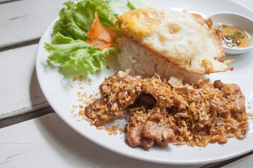Fried pork with crispy garlic on rice + Fried egg