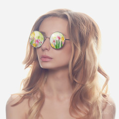 beautiful woman in sunglasses with flowers