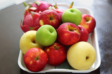 fruit in a tray on wood table
