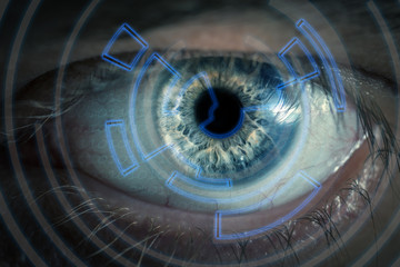 Blue man eye with contact lens, macro shot. Shallow depth of fie