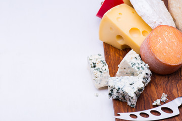 Cheeses on chopping board