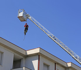 expert firefighter down with the rope in the building during a f