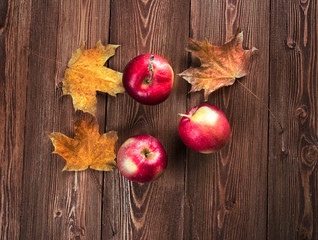Autumn border from apples and fallen leaves