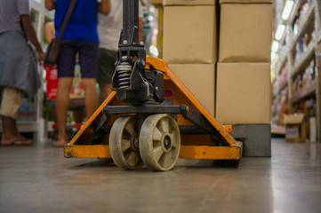 Storage cart with boxes on it in supermarket