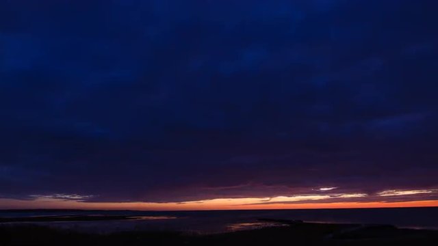 This time lapse shot of a blue orange sky at the coast of Torekov in Sweden was recorded in a midsummer night in June. 