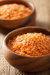 raw healthy red lentils in bowls