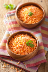 raw healthy red lentils in bowls
