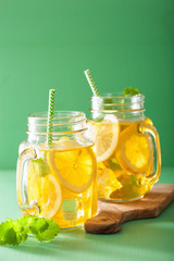 ice tea with lemon and melissa in mason jars