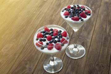 yogurt dessert with raspberries and blueberries