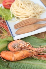 Pasta spaghetti with shrimp on the plate.