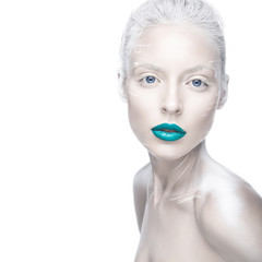 Beautiful girl in the image of albino with blue lips and white eyes. Art beauty face. Picture taken...