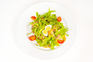 Pashot egg and salad with backed duck, rucola, cherry tomatoes