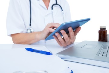 Doctor using a tablet in the office