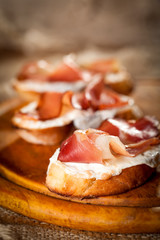 Italian bruschetta with prosciutto and Mozzarella
