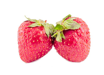 Red strawberries with green leaves, isolated
