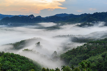 Obraz premium Layer of mountains in the mist at sunrise time, Baan Nai Wong, Ranong Province, Thailand