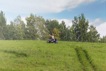 Obraz premium Elegant woman riding quadrocycle