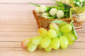 Portion of fresh Green Grapes on vintage wooden background