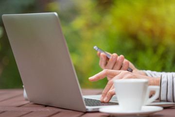 Woman with notebook on the garden