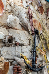 seashells and anchor hanged on wall as a decoration