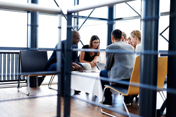 group of executives sitting together and working